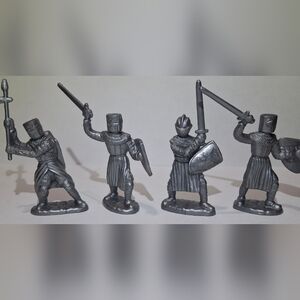 4 knight figures. in good pre-owned condition